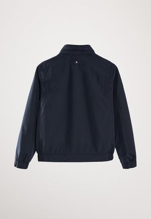 Veste légère bleu marine foncé à manches longues, poignets et taille élastiques, vue de dos sur fond uni.