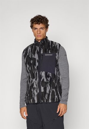 Fleece vest featuring a gray and black animal print with a solid black chest pocket. Gray long sleeves and zippered pockets complete the design.