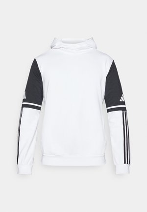 Hoodie blanc avec manches noires, présentant trois rayures noires sur chaque manche, et le logo de la marque sur la manche supérieure gauche. Texture lisse.
