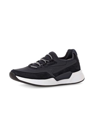 Black athletic sneaker featuring mixed materials, including smooth and suede textures, with silver laces and a white rubber sole.