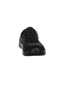 Black athletic shoe featuring a textured upper with mesh paneling, lace-up design, and side zipper. Durable rubber sole for traction.