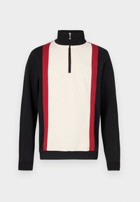 Trui met een halve rits kraag, met een crèmekleurig voorpand met een patroon, zwarte mouwen en rode zijstrepen. Gestructureerde stof.