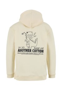 Sudadera con capucha de color crema que presenta un gráfico de dinosaurio negro y texto en la parte posterior. Hecha de algodón con puños y dobladillo acanalados.