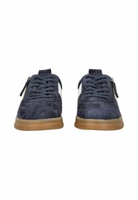 Navy suede sneakers with a white accent, featuring laces and a side zipper. Rubber sole with a textured finish. Lightweight design.
