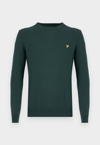 Dark green knitted sweater with long sleeves, crew neckline, and a small yellow bird logo on the chest. Smooth texture, no patterns.