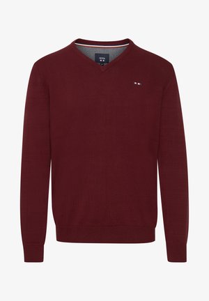 Suéter burdeos con cuello en V, fabricado en tejido de punto, con mangas largas y un sutil detalle del logo en el pecho. Textura suave y forma ajustada.