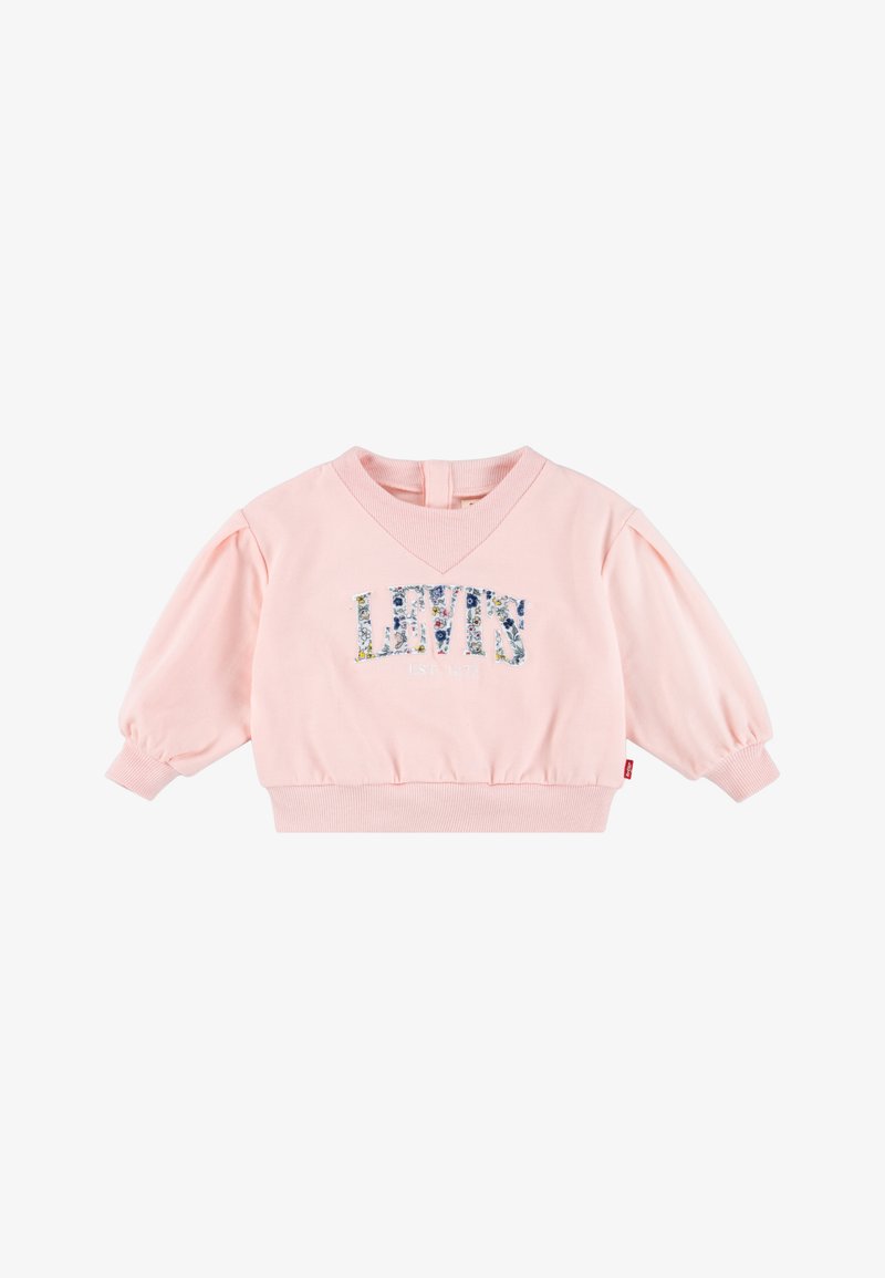 Roza bombažna majica s puhastimi rokavi, ribanim robom in V-izrezom. Na sprednji strani je cvetlični vzorčast "LEVIS" logotip.