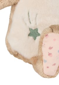 Soft beige plush toy with a fluffy texture, green star embroidery, and a pink paw pad featuring a multicolored pattern of small shapes.