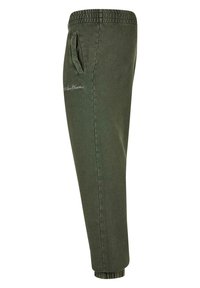 Grønn bomullsblandings joggebukse med elastisk midje, sidelommer og ribbestrikket kant, med brodert tekst på den øvre låret.