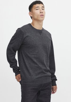 Dark gray knit sweater with long sleeves, round neckline, and textured pattern. Ribbed cuffs and hem provide a snug fit.