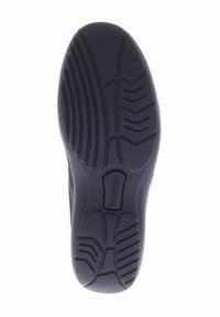 Zwarte rubberen schoenzool met een gestructureerd oppervlak en verschillende profielpatronen, waaronder groeven en richels voor grip.