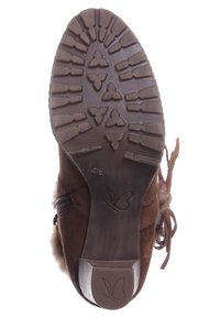 Suela de bota de ante marrón con patrón de tracción de goma. Presenta punta redondeada y forro de lana acolchado. Logotipo de mariposa en el talón. Talla 4.5.