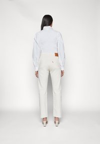 Levi's® CROP - Calças de ganga de perna direita - natural order