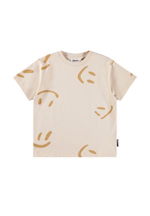 Μπεζ βαμβακερό μπλουζάκι με παιχνιδιάρικο μοτίβο από χαμογελαστές φατσούλες σε ανοιχτό καφέ χρώμα, με στρογγυλή λαιμόκοψη και κοντά μανίκια.