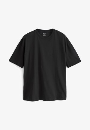 Svart kortärmad t-shirt i bomull. Har rundad halsringning och avslappnad passform. Slät textur utan synliga mönster eller detaljer.