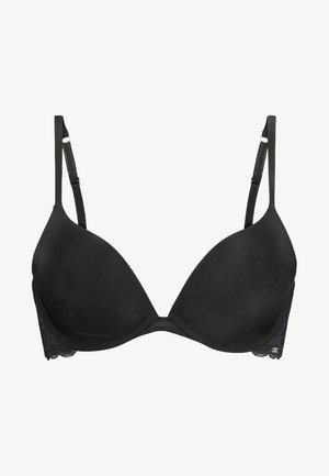 Soutien-gorge noir rembourré avec des coques lisses, des bretelles ajustables et une bordure en dentelle sur les côtés. Le design est sans couture avec un minimum de détails en matériel.