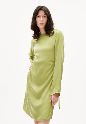 Long-sleeve dress in light green fabric, featuring a relaxed silhouette, round neckline, and subtle side slits at the hem.