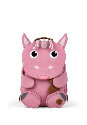 Pink children's backpack shaped like a smiling unicorn with ears, horn, large eyes, and a brown handle on white background.