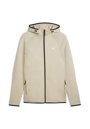 Veste à capuche beige avec fermeture éclair, garniture noire, poches latérales zippées et petit logo blanc Puma sur la poitrine.