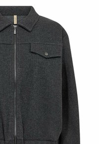 Dark grey zip-up jacket made of textured fabric, featuring a point collar, one chest pocket, and subtle metal hardware accents.