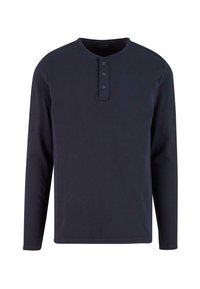 Maglietta henley a maniche lunghe color navy in tessuto a costine, con scollatura rotonda e tre bottoni sul davanti.