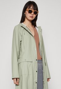Rains CURVE JACKET UNISEX - Parkas - earth