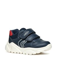 Sneaker blu navy con suole in gomma bianca, dotate di doppie fasce in Velcro, dettagli in mesh e un logo argento discreto sul lato.