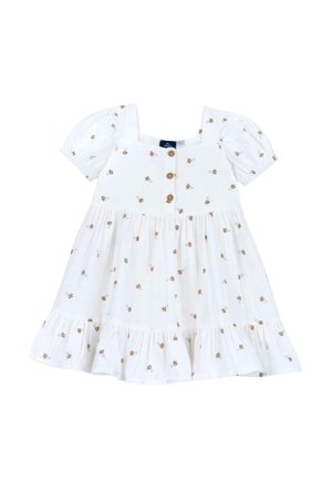 Abito in cotone bianco con maniche a campana, scollatura quadrata e chiusura con bottoni. Accentuato da piccoli motivi floreali marroni e un’orlo arricciato.