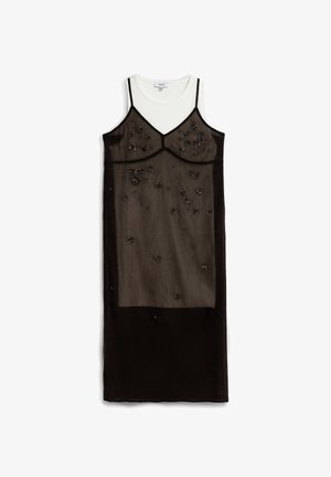 Black sheer slip dress with thin straps, floral bead embellishments, layered over a white sleeveless top, displayed on a white background.