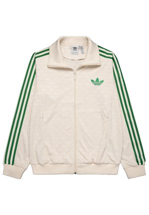 Flødefarvet Adidas jakke med lynlås med grønne striber på ærmerne og grønt trefoil-logo på venstre bryst, ribstrikket krave og manchetter.