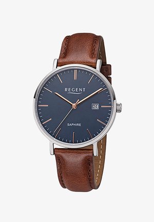 Montre analogique avec un cadran bleu marine, des index en or rose, un boîtier en argent et un bracelet en cuir marron. Présente un affichage de la date à 3 heures.