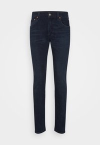 Mörkblå denimjeans med slim fit, som har fem fickor, kontrasterande orange sömnad och en främre knappstängning.