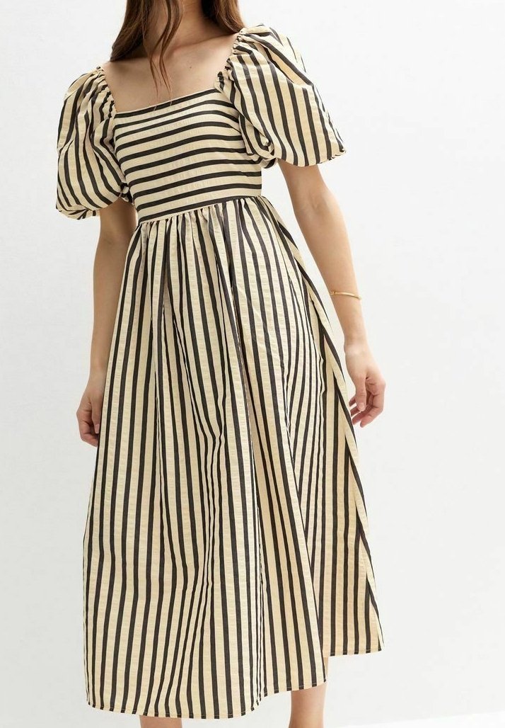 Raidallinen midi-mekko puffihaaroilla. Ominaisuuksia ovat vuorotellen mustat ja beige raidoitus, neliökaula-aukko ja valuvat hameet.