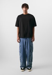 Don't Waste Culture - NUBILA UNISEX - Basic T-shirt - black Thumbnail Image 1