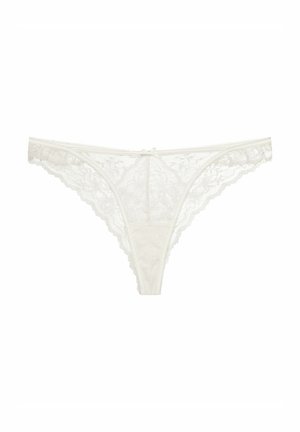 Lace thong in ivory, featuring floral patterns, scalloped edges, and a small center bow. Lightweight, delicate fabric for comfort.