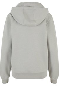 Sweat à capuche gris clair avec manches longues et poignets côtelés, vu de dos sur fond blanc.