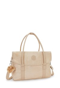 Beige stof håndtaske med flaplukning, to håndtag og en aftagelig pelsabe charme. Har prægede logo og justerbar rem.