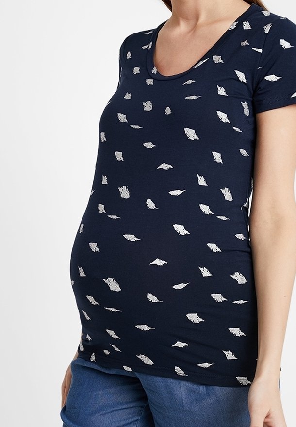 Navy blue maternity t-shirt with a scoop neck, featuring a silver leaf pattern throughout. Made from soft jersey fabric, fitted shape.