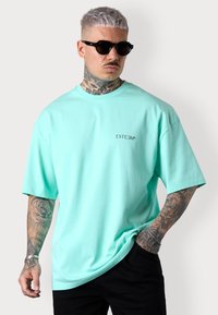 DISCREET OVERSIZED - T-shirt basique - beachgreen