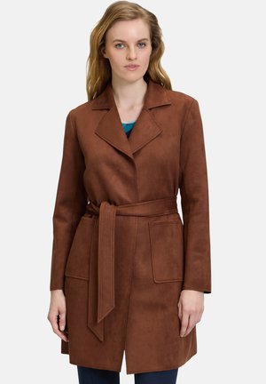 Brown suede coat with a tailored fit, wide lapels, belt at the waist, and two front pockets; smooth texture and knee-length design.