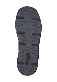 Semelle de chaussure en caoutchouc noir avec un motif de grip texturé, présentant des rainures horizontales et des crêtes verticales, portant l'étiquette "TOM TAILOR".