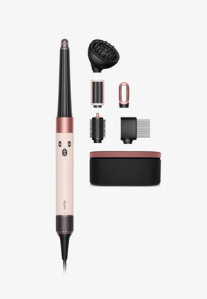 Haarstylingshulpmiddel in lichtroze met een zwarte cilinder, inclusief vijf verwisselbare opzetstukken en een zwarte opbergdoos met een roze deksel.