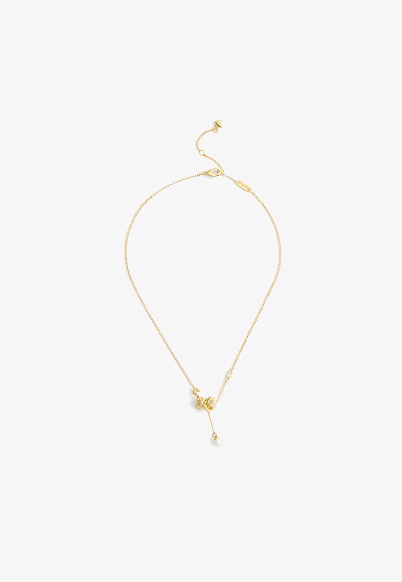 Delicate gold chain necklace with a small dog-shaped charm and a dangling white pearl on a simple clasp.