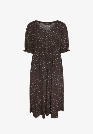 Donkerbruine jurk tot op de knie met witte stippen, korte pofmouwen met ruches aan de randen, V-hals en drie knopen aan de voorkant.