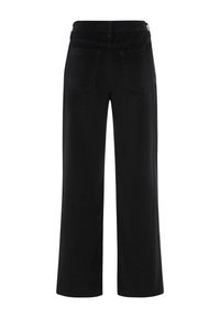 Black wide-leg corduroy pants with an elastic waistband, featuring two back pockets and soft texture. Design is simple and functional.