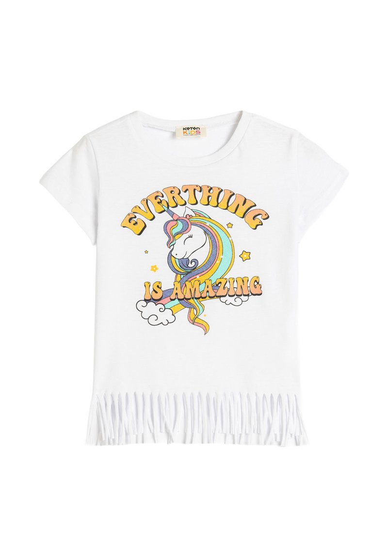 Vit bomulls t-shirt med en färgglad enhörning grafik och texten "ALLTING ÄR FANTASTISKT" samt fransar i nederkant.