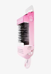 Pink-handled brush with black nylon pins in pink packaging labeled "Scalp Exfoliating Nylon Pins," "Easyglide Detangling Brush," and "PETA Approved."