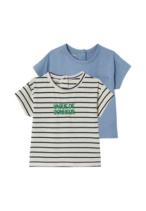 Two short-sleeve toddler shirts, one light blue with chest pocket, one white with black stripes and green "VAGUE DE BONHEUR" text.