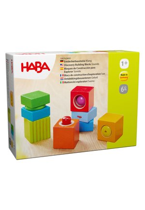 Colorful wooden sound discovery building blocks in green, blue, red, orange, and yellow, designed for children aged 1 and up.