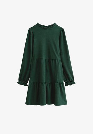 Dark green long-sleeve dress made of textured fabric, featuring a ruffled neckline and a tiered, flared skirt. Gathered cuffs at sleeves.